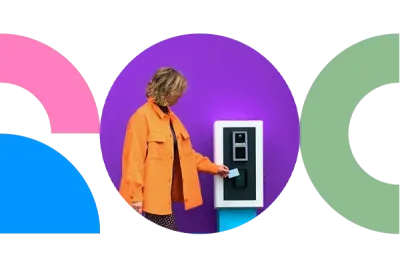 A women paying at a parking ticket machine A women paying at a parking ticket machine