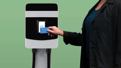 Woman paying at EV charging station
