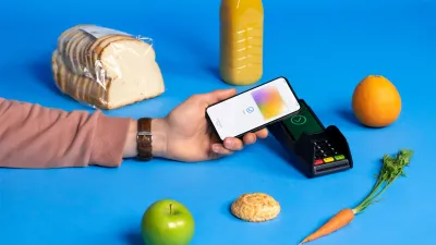 A payment happening next to grocery essentials